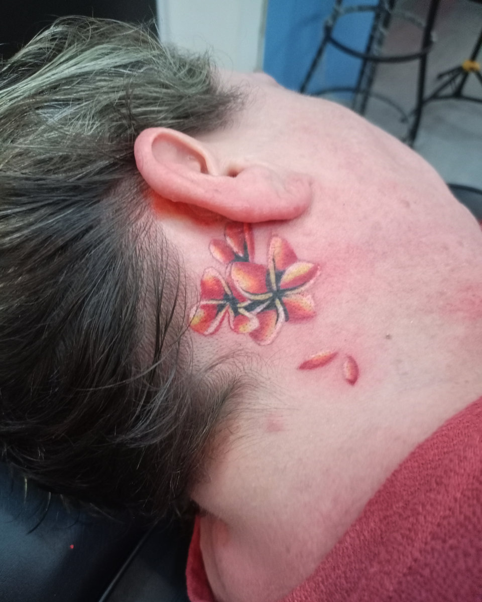 Anahata Ink Tattoo Kuta Bali - Small Colorful Frangipani Tattoo on the Neck