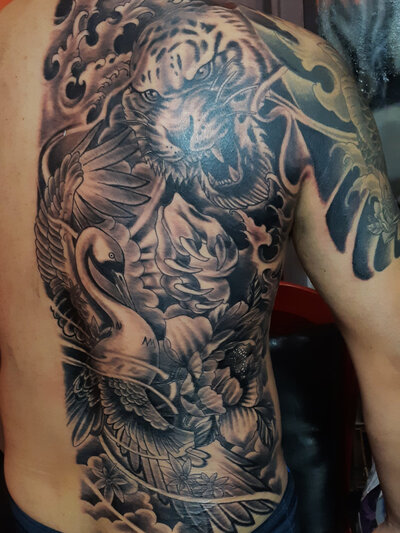 Anahata Ink Tattoo Kuta - Old School Half-Back Jungle Theme Tattoo Style with Tiger